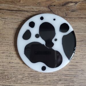 Cowhide print epoxy resin coaster.  Black and white.